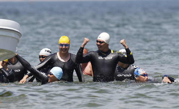 Relay swimmers conquer the treacherous Taiwan Straits